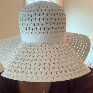 New without tags White 100% paper floppy hat with white ribbon band. Very chic